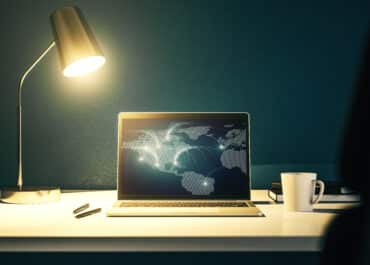 Modern computer monitor with abstract digital world map with connections, research and strategy concept. 3D Rendering